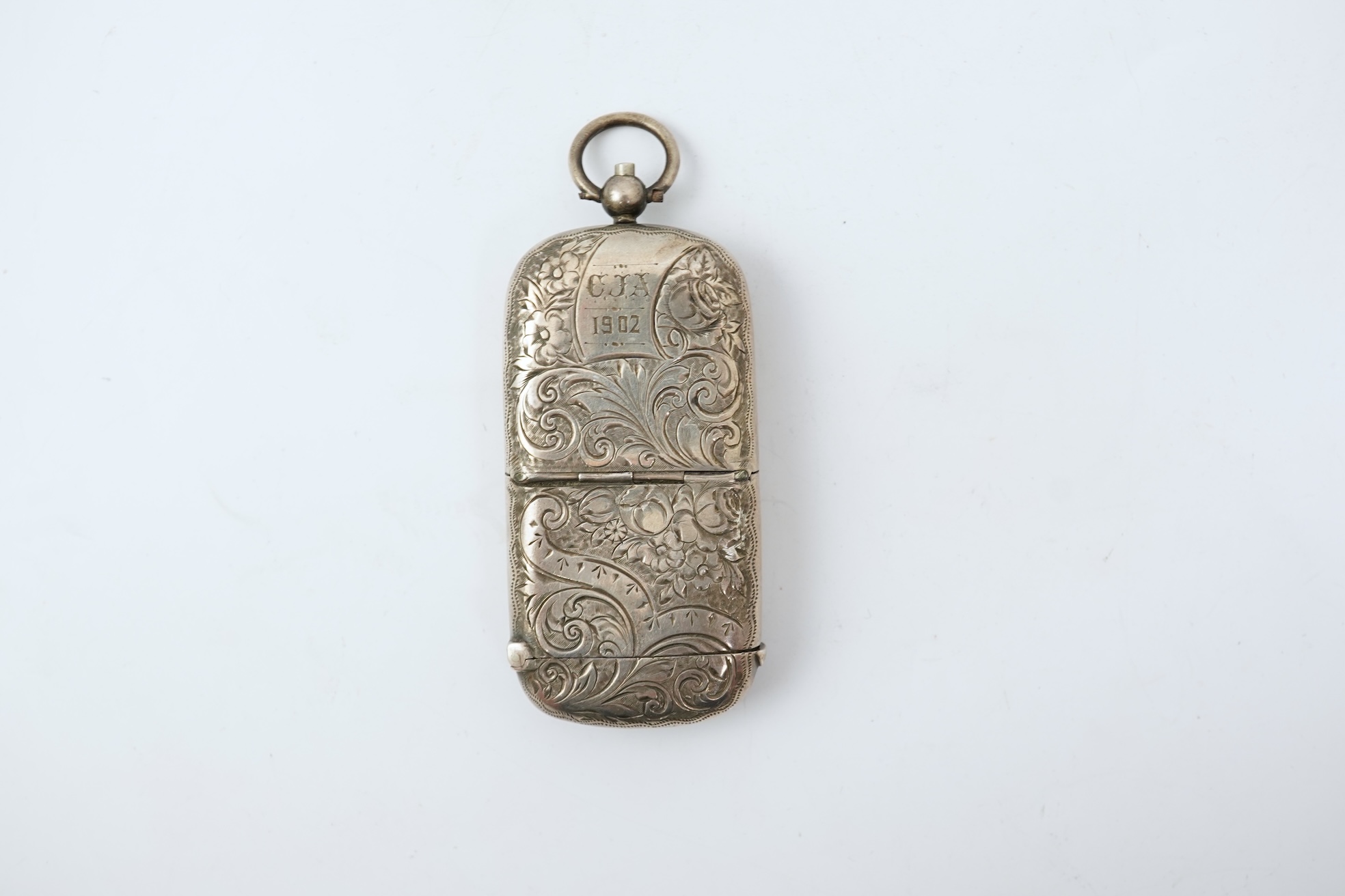 A late Victorian engraved silver oval combination sovereign and vesta case, by JW